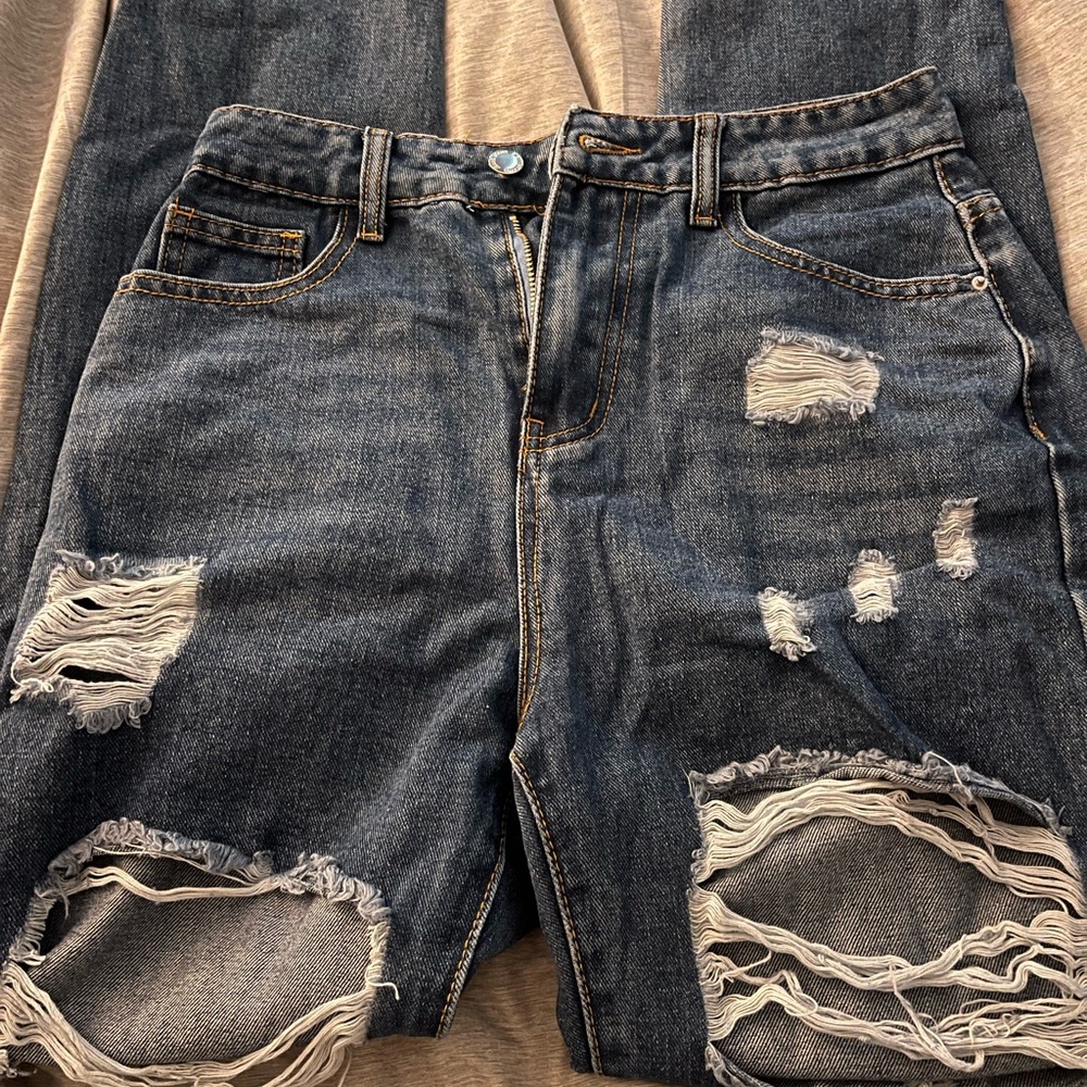 Distressed Blue Denim Jeans